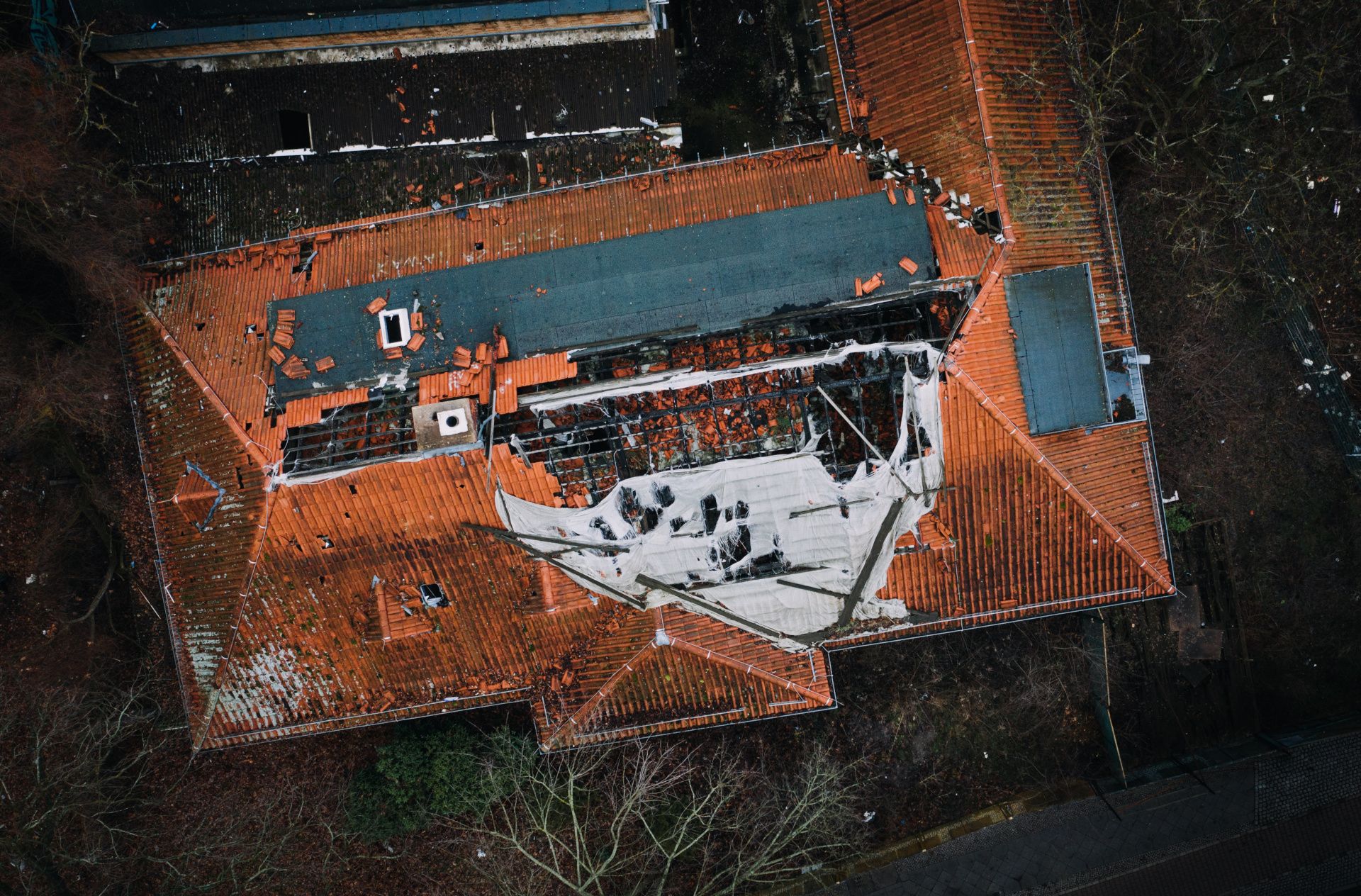 aerial view of badly damaged roof