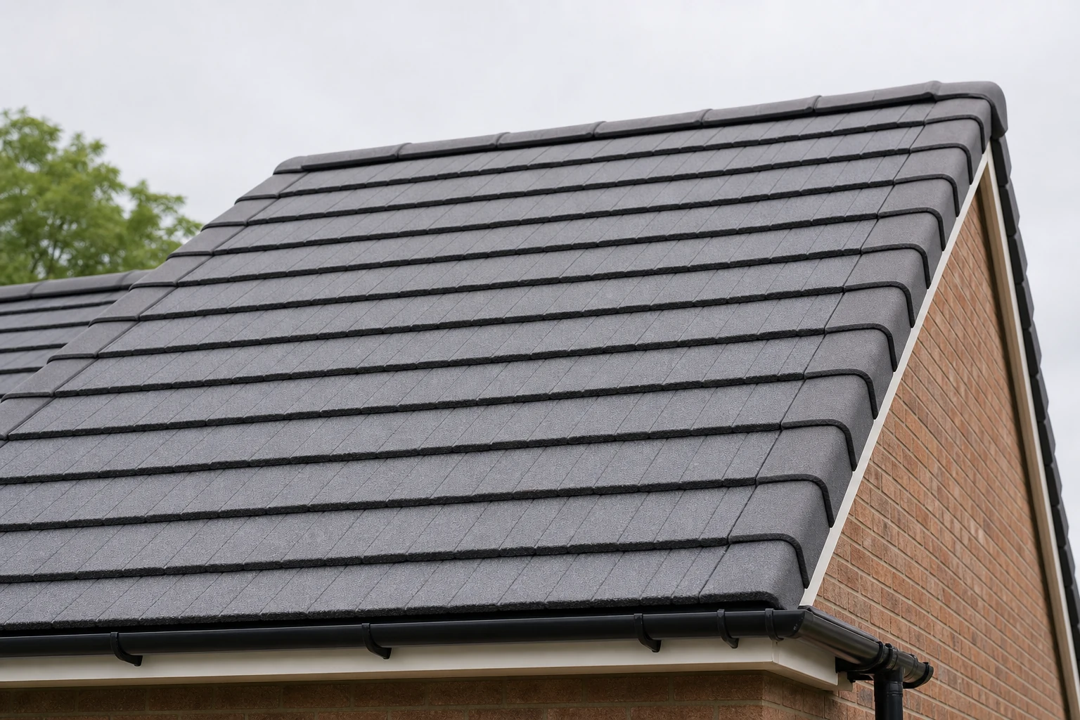 Neatly repaired tiled roof with clean gutter line